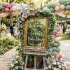 A beautifully decorated entrance for a baby shower with floral arrangements and a welcome sign.